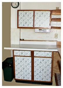 Brown and Trimmed Wall and Base Cabinets.