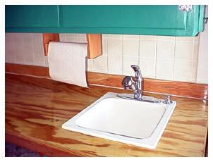 The Sink in the Hand-Built Work Top.  Note the hand-made paper towel holder.