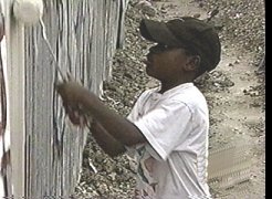 Young SAMPLE student does his part to rid LA of some graffiti.