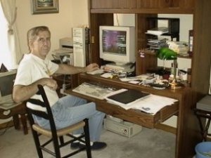 John at his computer