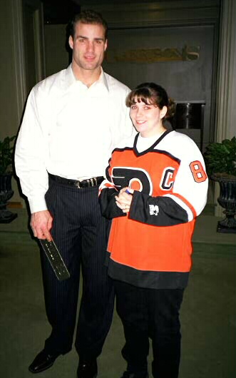 My wife getting a back rub from Eric Lindros.  She didn't really like hockey 'til then.  Go figure!