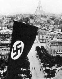 By 1943 Paris was a city under the control of the Nazi-dominated German Army.  Here you see the swastika flag of the Nazis flying high over Paris.  Notice the Eiffel Tower in the background.