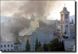 Smoke rises over the Church of the Nativity during fighting at Bethlehem.